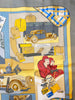 Grey, yellow, and blue scarf with automobile print.