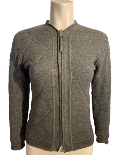 Grey quilted wool sweater with zipper front. Waist length 