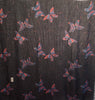 Oversized Black and metallic woven scarf with a print consisting of red and purple butterflies.