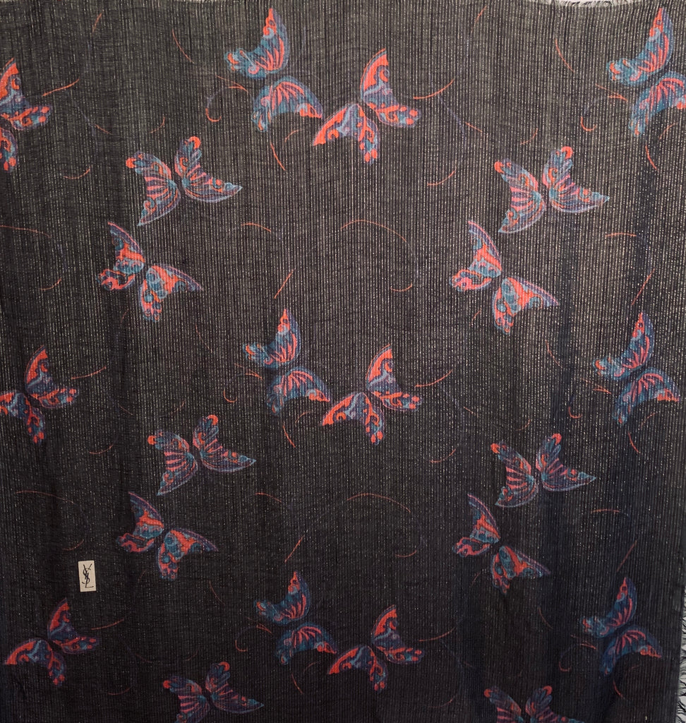 Oversized Black and metallic woven scarf with a print consisting of red and purple butterflies.