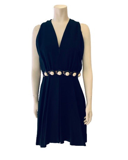 Black, heavy-linen, sleeveless, knee-length dress with an attached white, gold, and black beaded belt. 