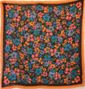 Emanuel Ungaro scarf with a floral print in coral, periwinkle, blue, orange, and green.