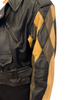 Black, zip-up leather jacket with diamond-shaped patchwork sleeves in black, brown, and tan.