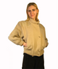 beige wool waist length jacket with knitted wool sleeves and banded bottom. Four front buttons