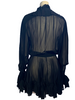 Sheer, long-sleeve, silk dress with bow at neck, and ruffles at wrist. Gathered waist. Length is above the knee.