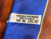 Small square silk pocket scarf with a blue border, mottled brown center pattern and the word BELAMI on the right bottom corner.