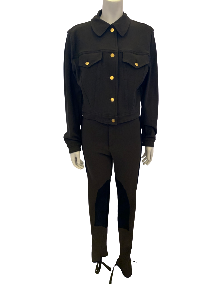 Olive green, ribbed, two-piece set. Cropped, collared jacket with gold buttons. High-rise, lace-up pants with black, suede panels and stirrups. 