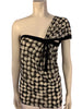  Black and white, dot-print, mesh top with an asymmetrical, single-sleeve and black bow. 