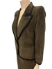 Olive-green, corduroy, two-piece skirt suit. Single-button jacket with wide lapels. Double-pleated skirt. 