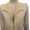 Cream wool cropped jacket with rounded collar and two patch pockets