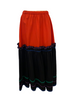 Red & black, two-tier, long-skirt with green, purple, and blue ric-rac. 