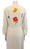 White maxi dress with colorful flower appliques