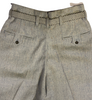 Closeup back view of 1950s grey pleat front trousers with a belt