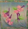Square silk scarf with floral pattern in blue, pink, purple and green