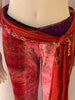 Red, tie-dye, velvet, bejewelled, two-piece set. Consists of bell-bottom pants and halter bra-top. 