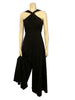 Black, wide-leg, cross-halter jumpsuit with slit in neckline.