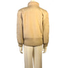 beige wool waist length jacket with knitted wool sleeves and banded bottom. Four front buttons