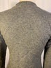 Grey quilted wool sweater with zipper front. Waist length