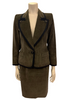 Olive-green, corduroy, two-piece skirt suit. Single-button jacket with wide lapels. Double-pleated skirt. 