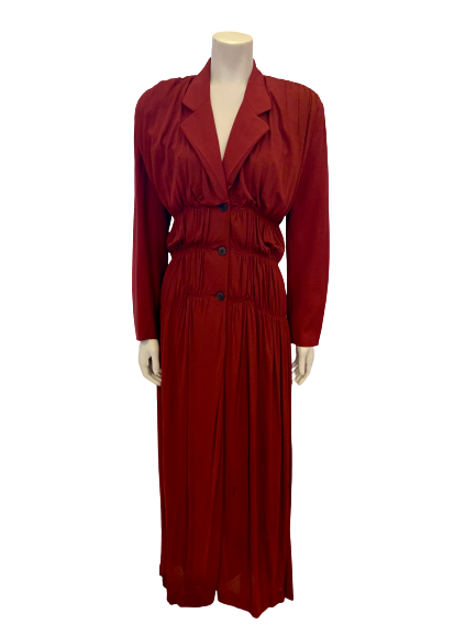 Rust color, ruched, floor-length dress with three buttons, notched lapel, and long sleeves.