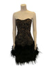 Strapless, black dress with all-over gold & black beading in a swirl pattern. Rows of black, marabou feathers at the bottom hem. 