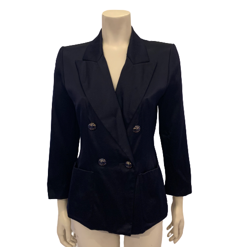 Navy blue silk blazer with notched collar and four metal buttons in blue with gold polka dots. 