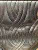 Black leather Fendi handbag with stitched leather body in a wavy pattern. The handles and hardware are in gold-tone metal and chain.