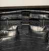 Black, leather, faux-crocodile patterned bag with strap. 