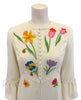 White maxi dress with colorful flower appliques