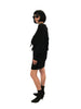 Black, stretch, dolman-sleeve, above-the-knee dress with oversized shoulder-pads. 