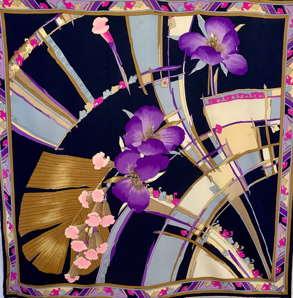 Square silk scarf with a pattern of geometric shapes and florals in black, brown, purple, blue, pink and creme