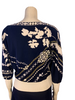Navy, long-sleeve shirt with white and gold, chain and flower print. Ribbed bands at the sleeves and waist.
