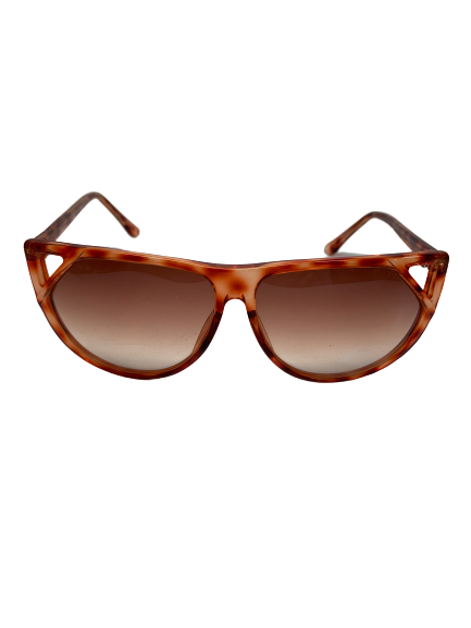 Amber tortoise color plastic sunglass with triangle cutout on sides and amber lenses 