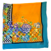 Gianni Versace Geometric & Floral Scarf-light backdrop colors orange,pink and blue with repeating geometric checker and Greek Meander pattern-folded view showing bottom right corner of Gianni Versace logo 