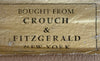 Label inside suitcase which reads "Bought from Crouch & Fitzgerald. New York."
