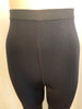 Black, high-rise leggings with stirrups. 