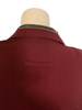 Burgundy blazer with a loop and a black, leather patch at back of neck.