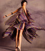 Sheer, knit, rainbow, striped tunic & skirt set with multi-layered draping. 