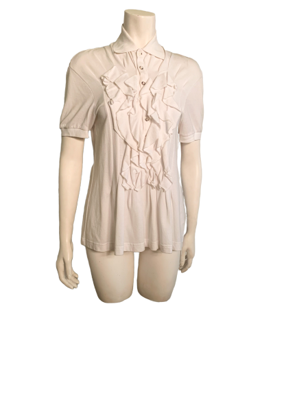 White  short sleeve top with pointed collar, three buttons and ruffle bib front. 
