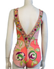 One piece bathing suit in Pucci print of orange, pink, green, yellow, and cream. Elastic stretch fabric. Deep V neck