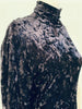 Close up of black velvet material on Norma Kamali black & white jumpsuit. 