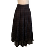 Long cotton dark plaid skirt with ruching at the hem. Colors are muted black, brown, burgundy. 