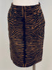 Front view of mannequin wearing brown & black tiger stripe printed pony hair pencil skirt.