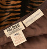 Close up of Bill Blass Bergdorf Goodman tag against brown lining in tiger stripe printed pony hair skirt.