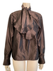 Iridescent copper silk blouse with long sleeves and a large bow at neck. Bottom of bow and cuff are trimmed  accordion pleats. Button down front 