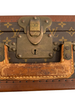 Large, hard, leather suitcase with an all-over “LV” monogram print. Brass hardware with "LV" stamp.