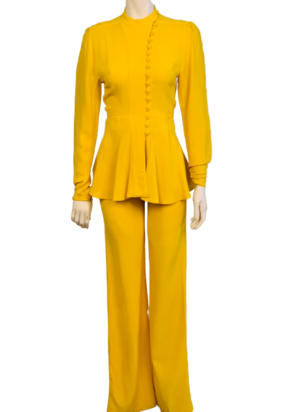 Marigold 2-piece set. High-neck, long-sleeve, asymmetrical, button-up jacket with slight peplum. High-waisted, wide-leg pants. 