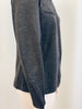Close up of asymmetrical zipper on the wrist of Claude Montana grey knit long sleeve shirt.