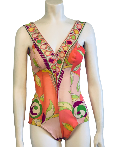 One piece bathing suit in Pucci print of  orange, pink, green, yellow, and cream. Elastic stretch fabric.  Deep V neck 