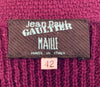 Close up of Jean Paul Gaultier Maille tag in purple knit & crochet dress.